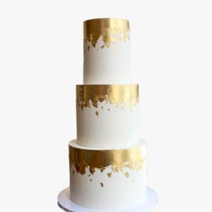 Three-tier gold white wedding cake