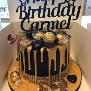 Black and gold drip birthday cake with chocolate topping