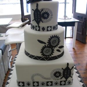 Three-tier tradition themed wedding cake